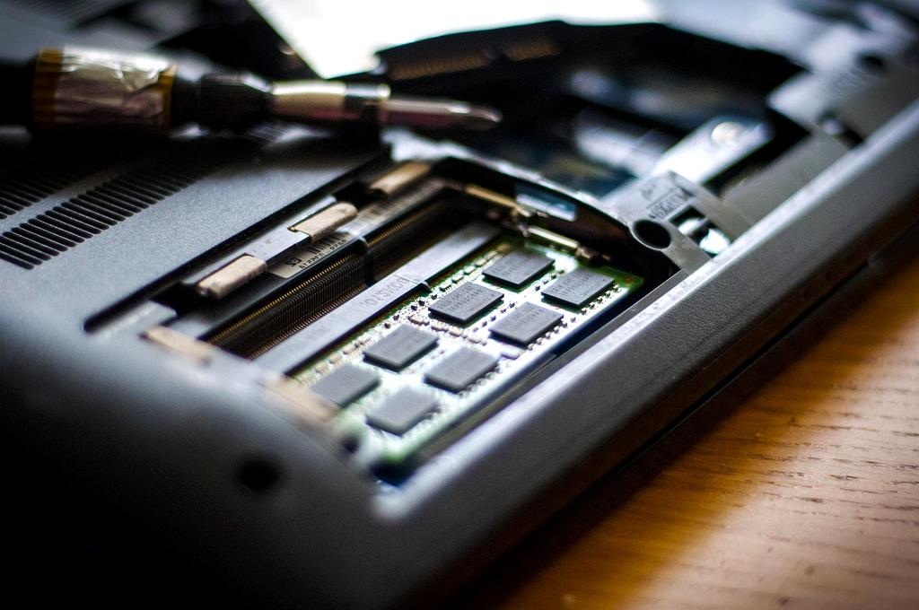 Hand installing RAM module into a desktop